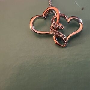 Silver rose gold with czs around the heart necklace